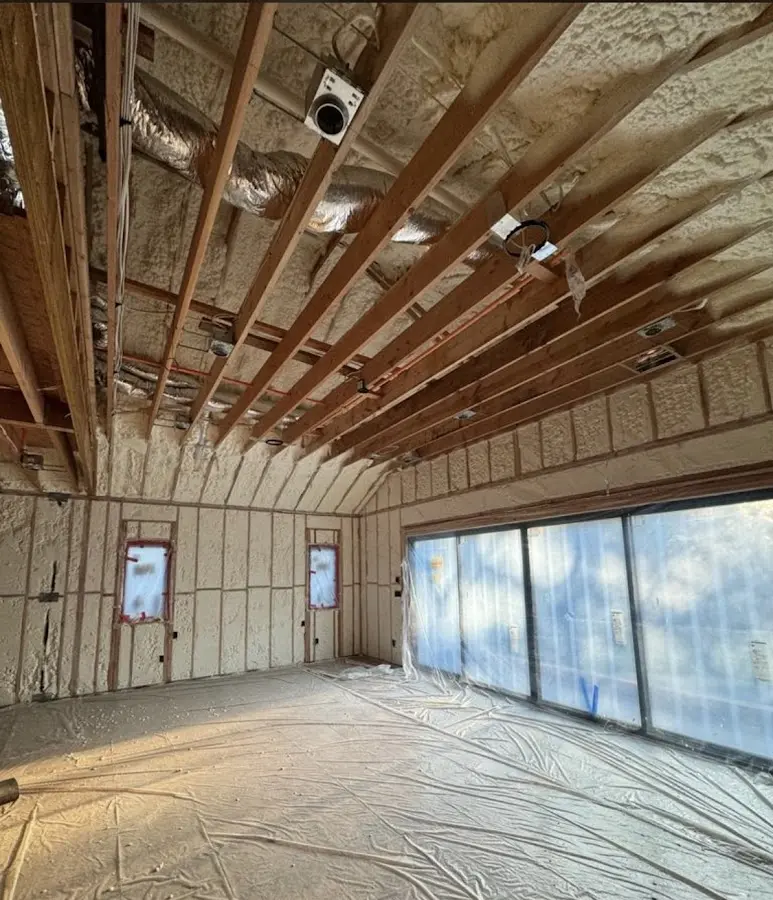 Interior walls and ceiling insulated with spray foam during new construction in New Brunswick